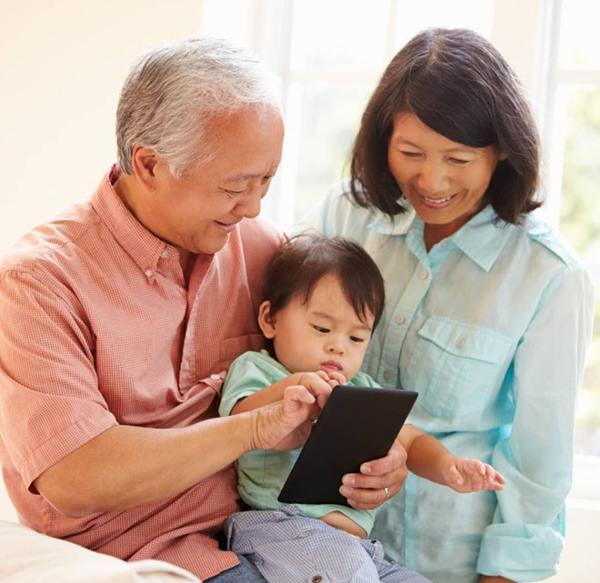 grandparents carrying a baby