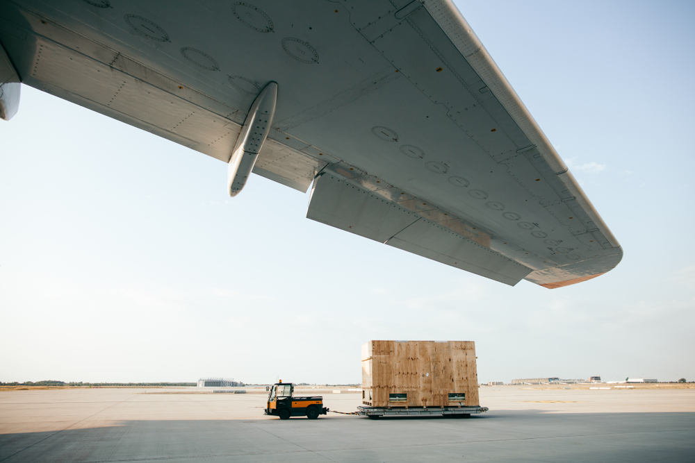 Cargo,Container,Is,Being,Carried,To,Airplane
