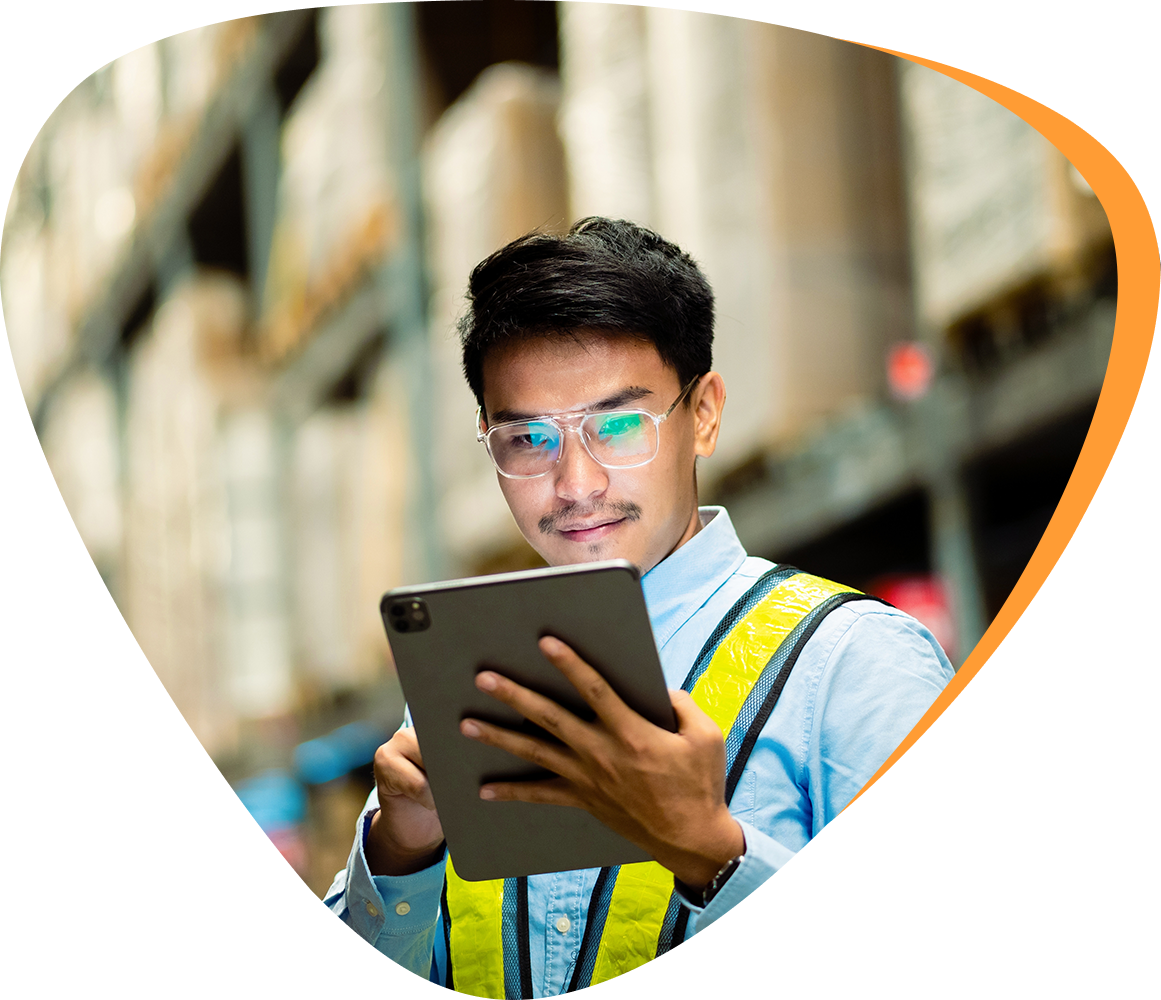 a logistics expert checking order on a laptop