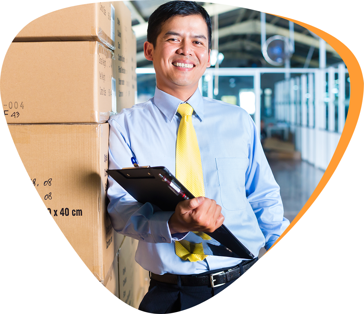a logistics expert leaning against several boxes
